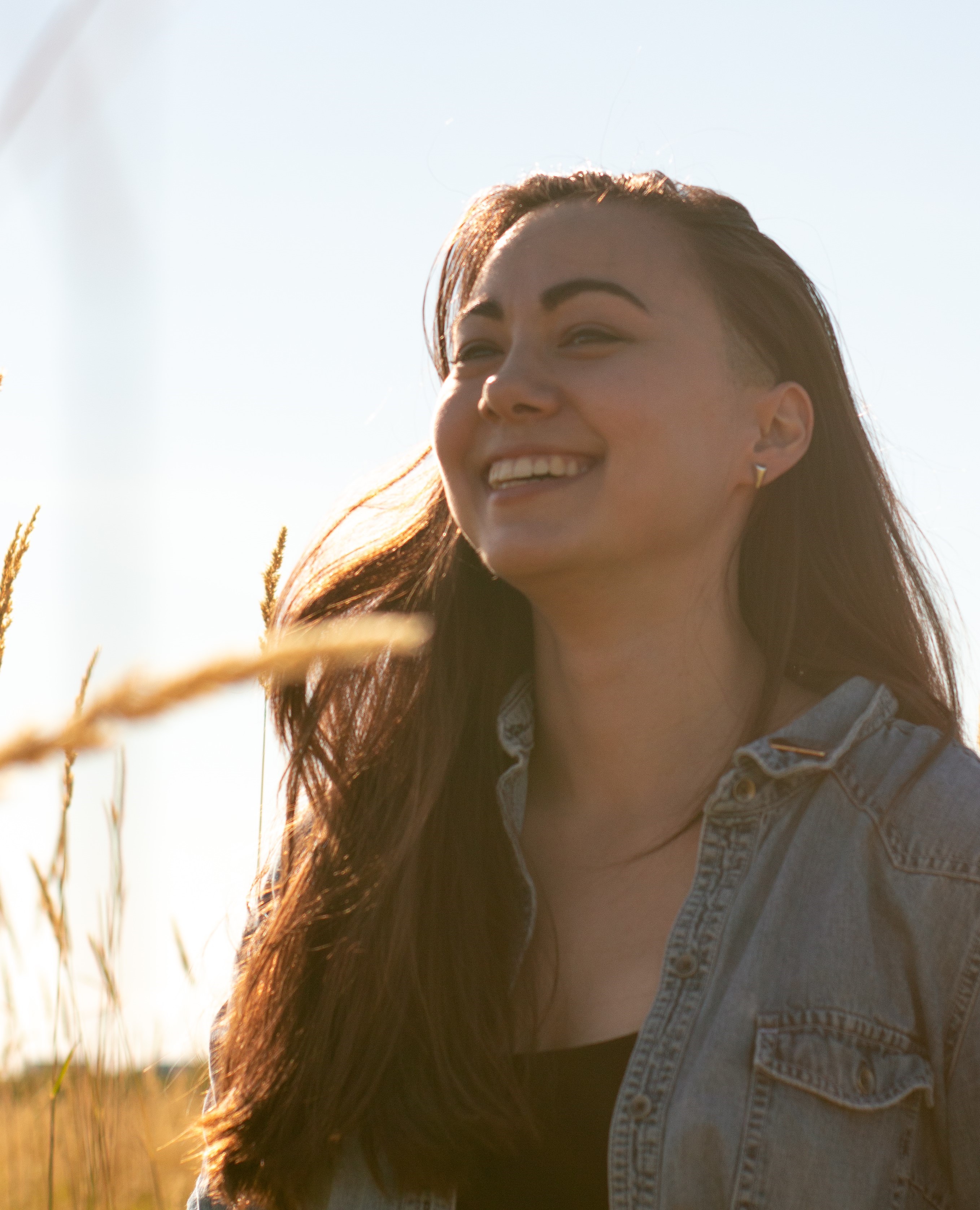 A black and white portrait of Breanne. She is looking off camera.