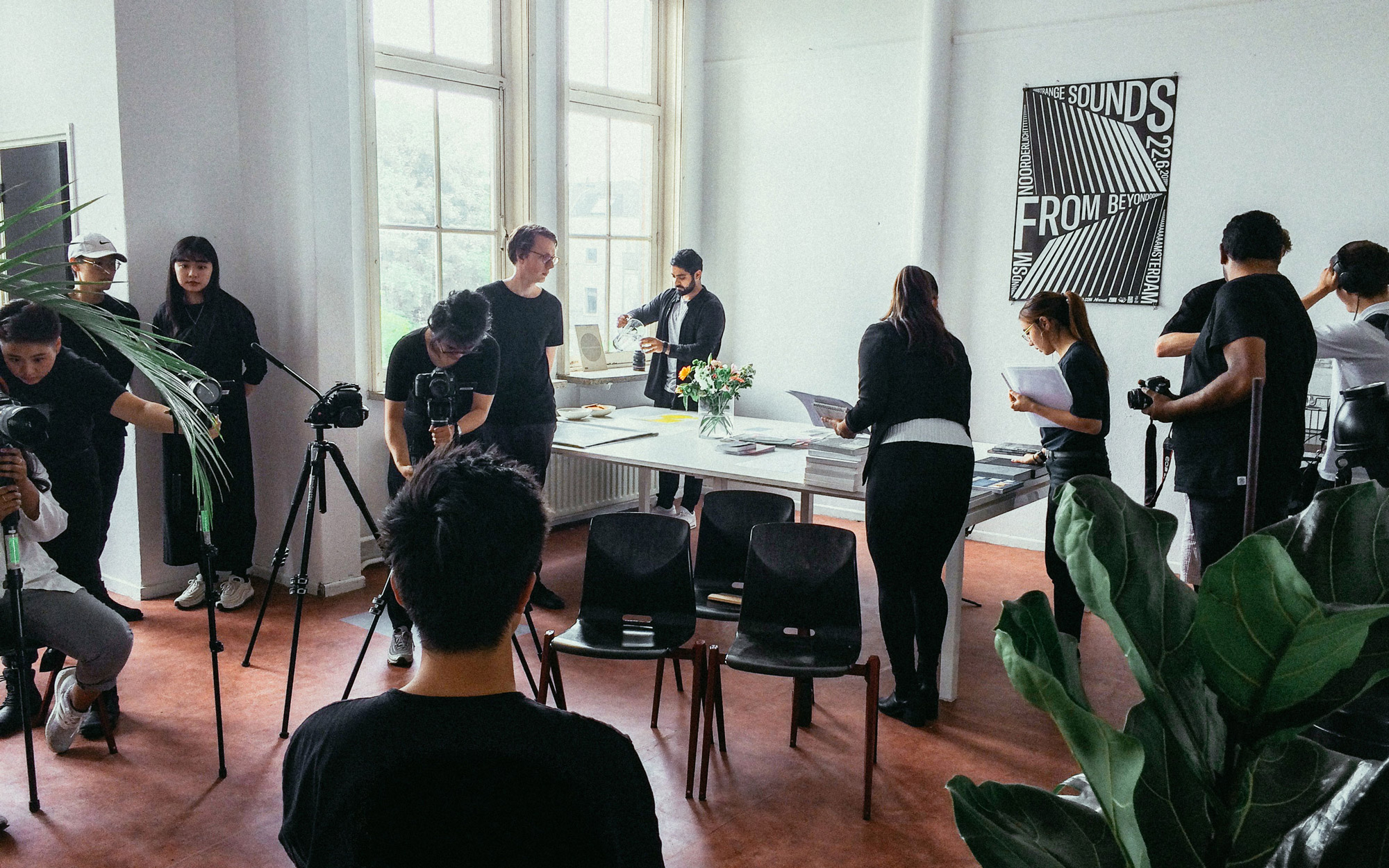 A picture of us on set, each busily moving about and taking care of our individual tasks